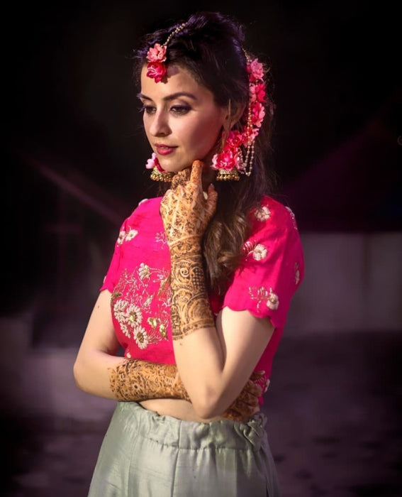 indian television star wearing pink handcrafted floral jewelry at her haldi 