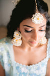 Real bride inspiration featuring off-white floral haath phools for a minimalist winter wedding look.