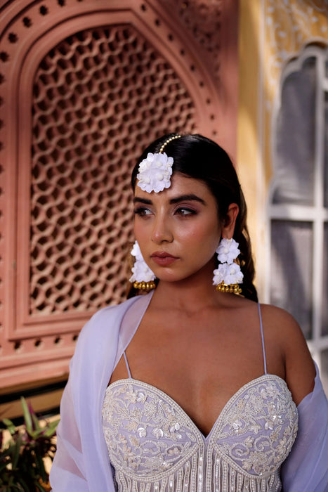 Close-up of handcrafted silk petals and intricate beadwork on Prune luxury floral Haath Phool.