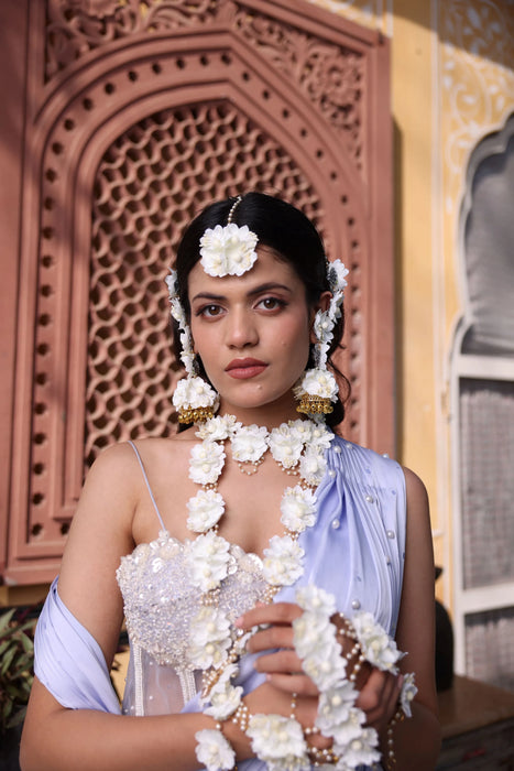 Modern bride wearing lightweight Shwet Kamal Floral Haath Phool with Kaleere for a luxury destination wedding.