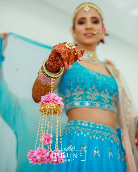 Bride wearing Prune Floral Kaleere with anita dongre lehnga 