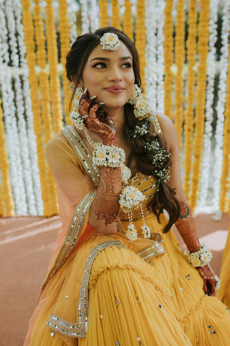 Sustainable floral haath phool with attached kaleere for a destination wedding Haldi.