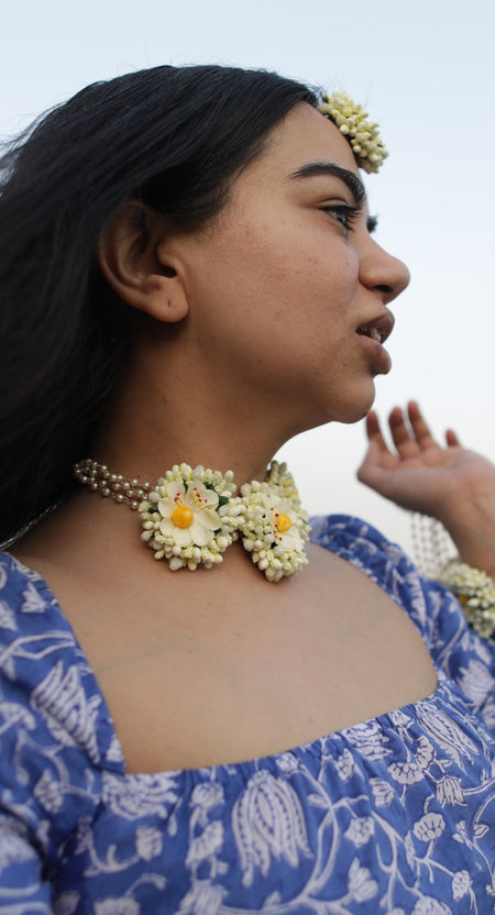 Prune India Founder modeling the Ivory Winter Bride grand floral jewelry set for the signature collection.