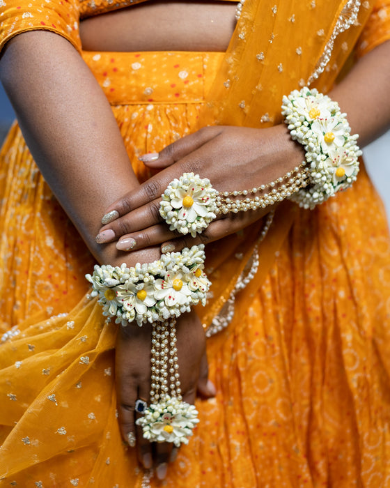 Close-up of handcrafted floral jhumkis with kaanchain on a real bride for a winter wedding.