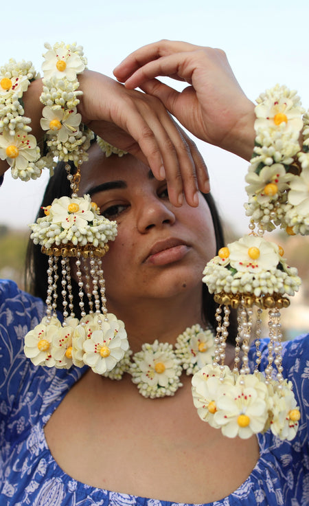 Close-up of handcrafted ivory floral kaleere from the Grand Bridal Set, featured on the Prune India Founder.